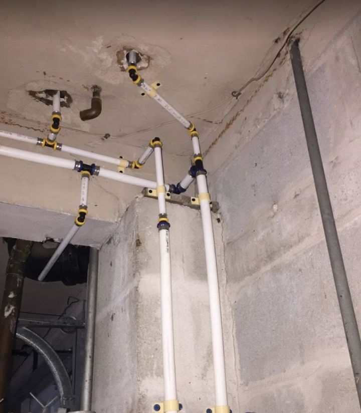 White PEX plumbing pipes running through a home