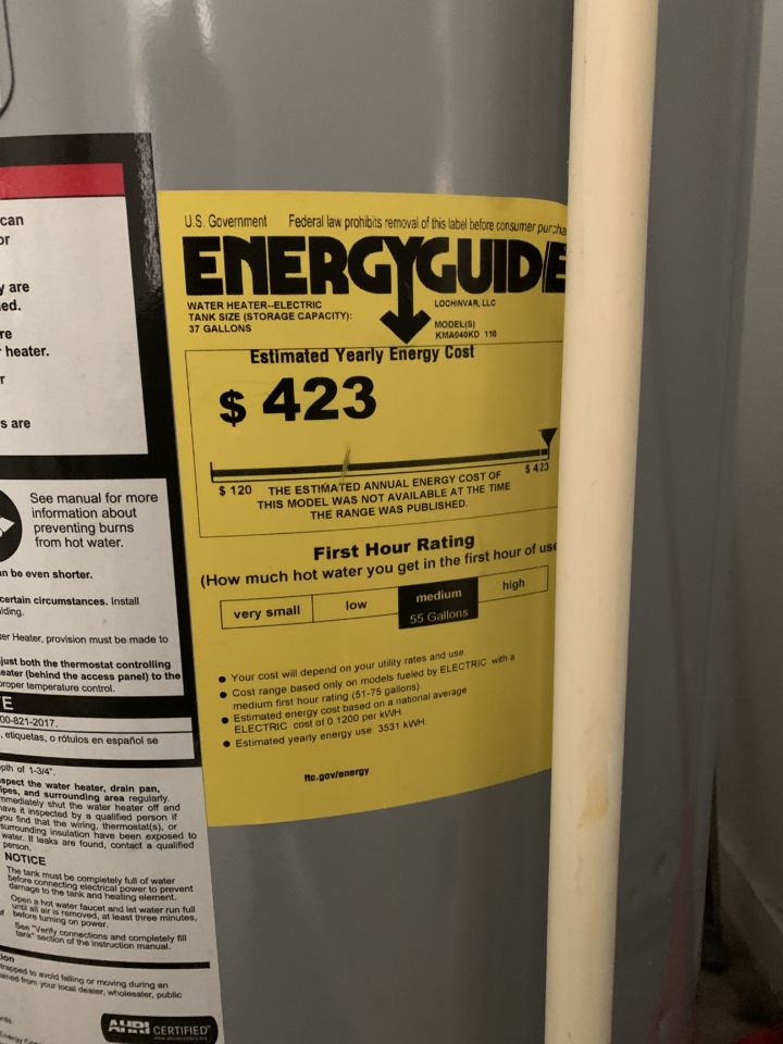 Closeup shot of a yellow Energy Guide sticker on a water heater.